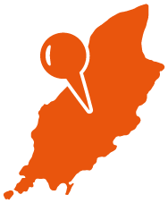 An orange map with a pin on it.