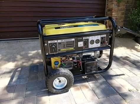 Portable diesel generator positioned on paving outside