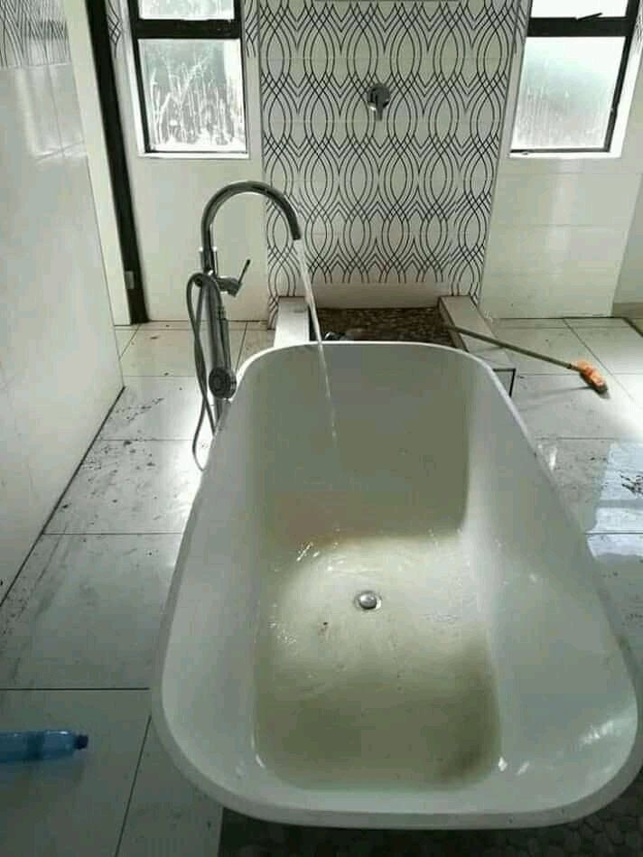 Stand alone white bath in bathroom