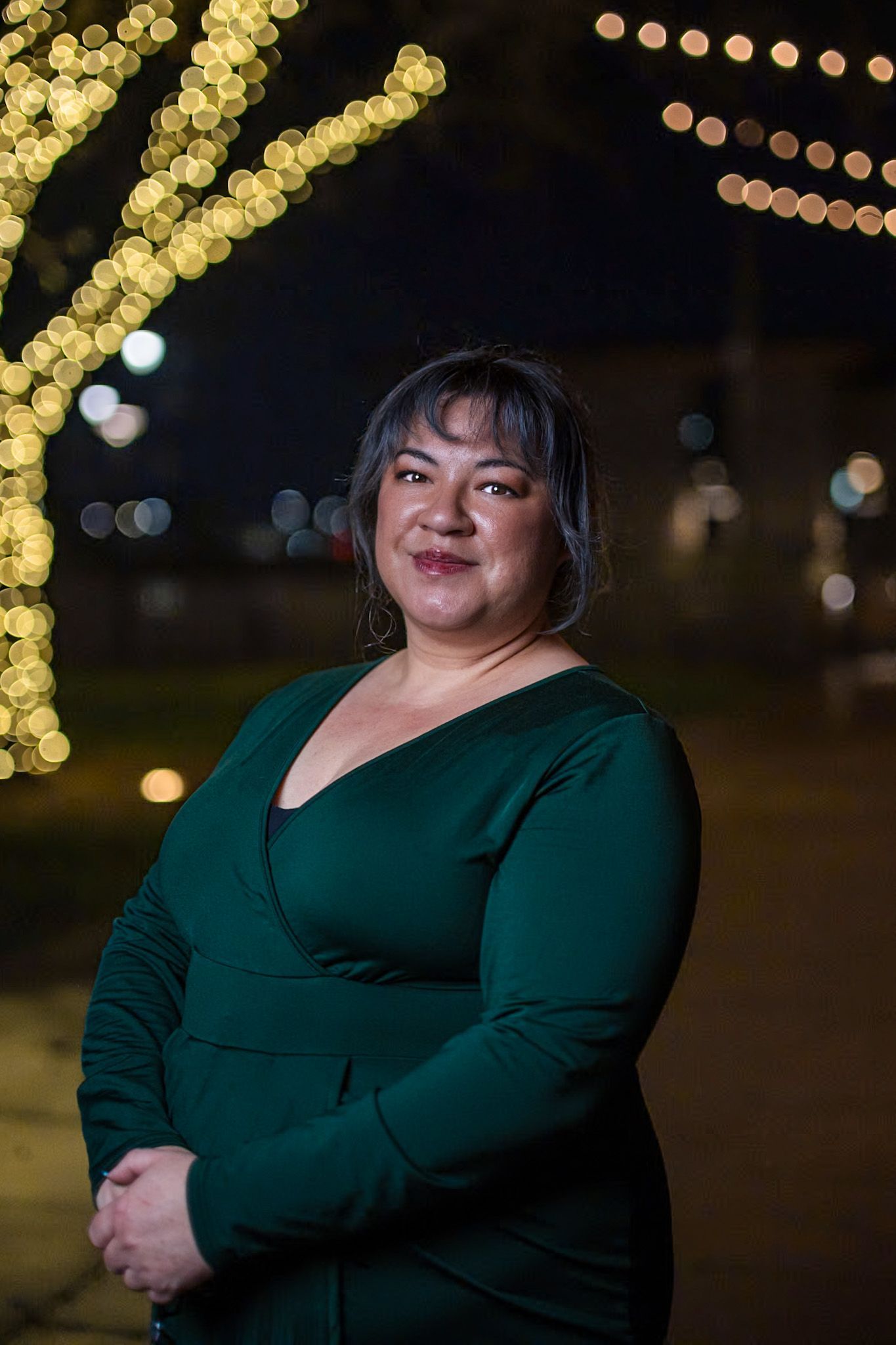 A white deer with antlers is in a circle on a white background.