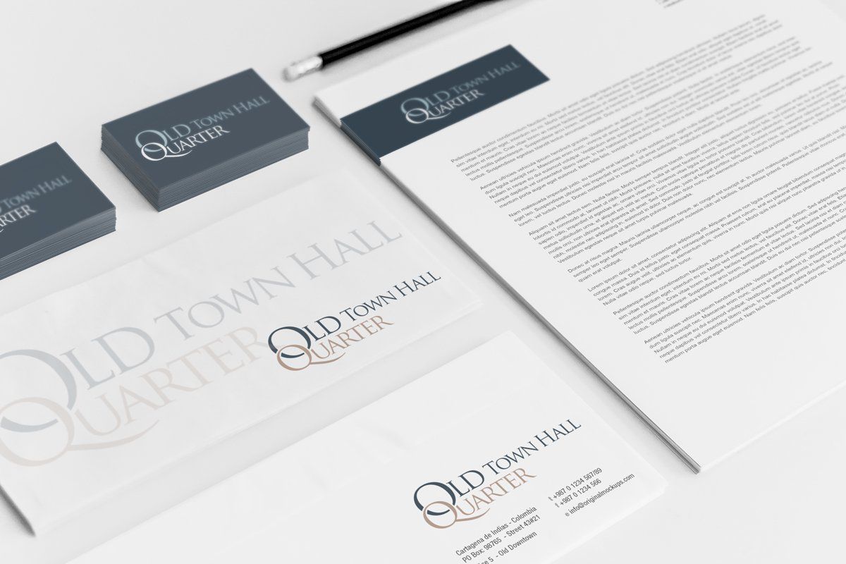 Stationery branding for Old Town Hall Quarter in gray, with business cards, letterhead, and envelopes.