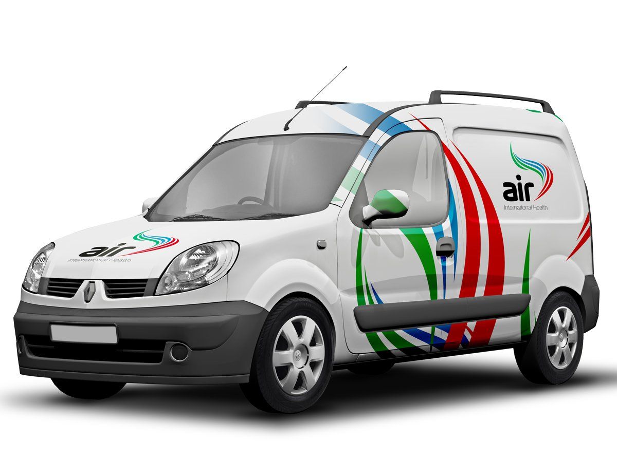 White Renault van with company logo, decorated with red, blue, and green designs.