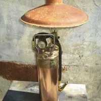 A copper fire extinguisher is turned into a lamp.