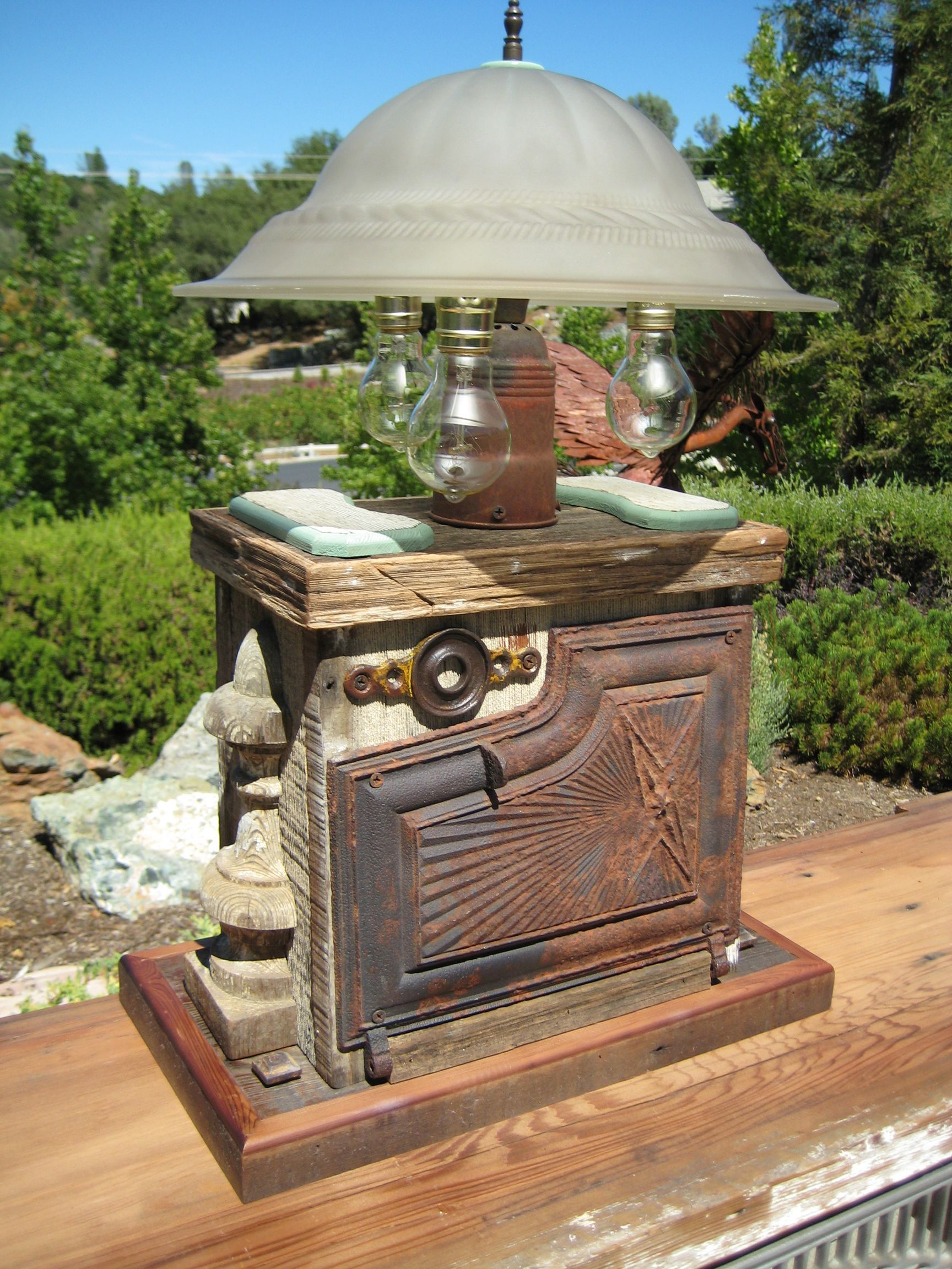 A lamp is sitting on top of a wooden table.