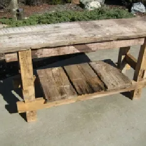 A wooden table with a shelf underneath it