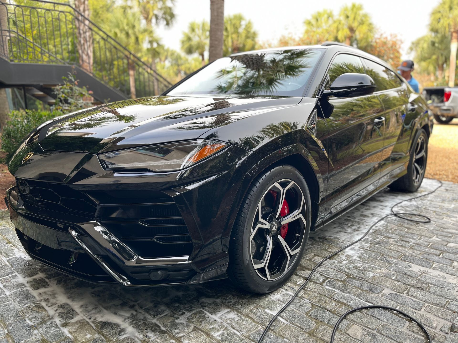 Image of a black car with a shiny coat, highlighting Elite Pro Detailing services.