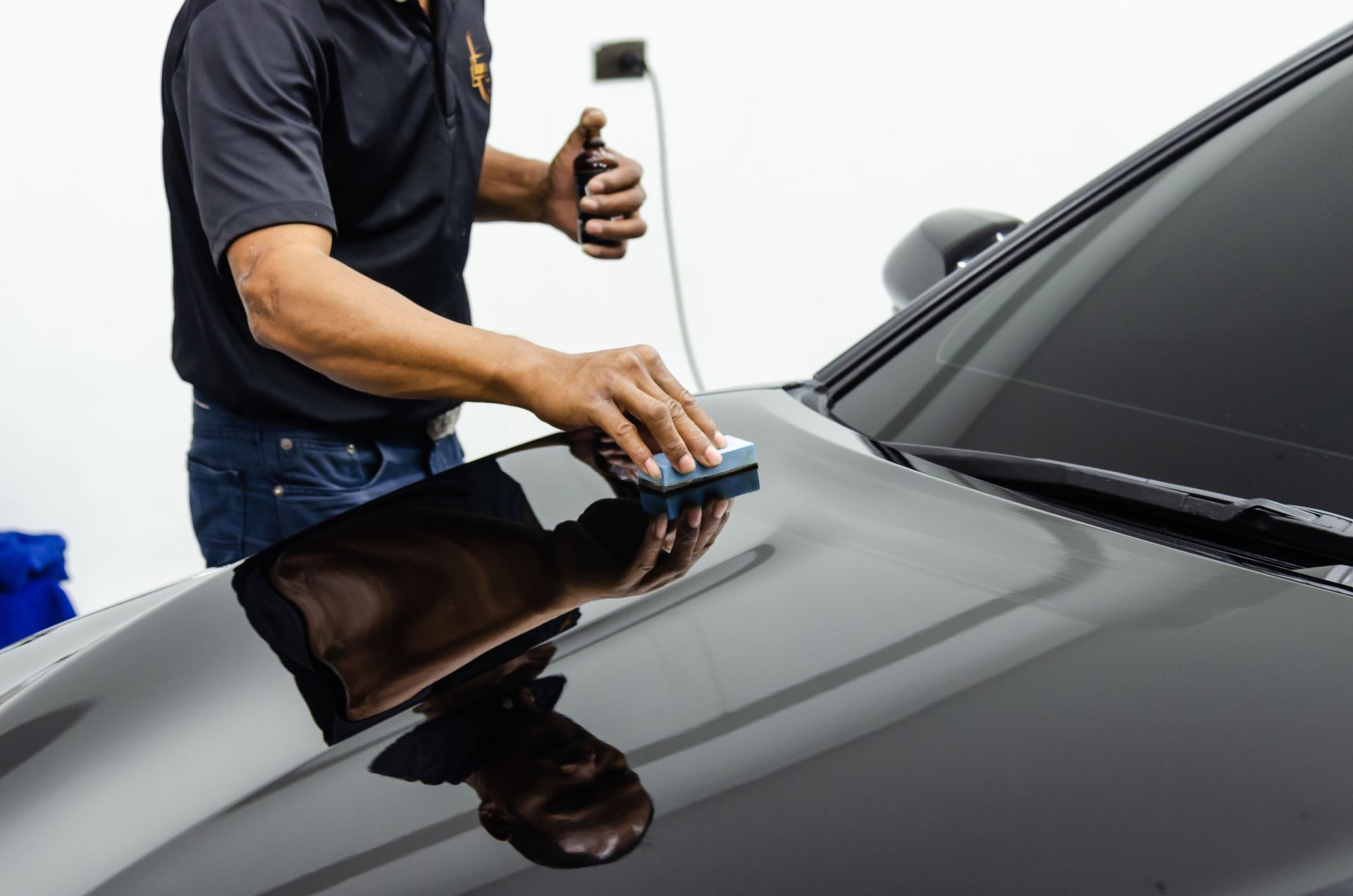 Ceramic coating being applied to a car window for enhanced protection.
