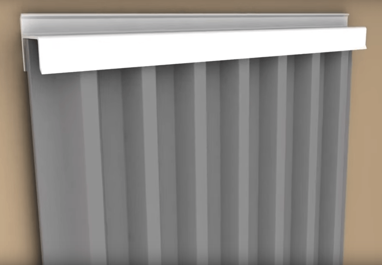 A gray vertical blind with a white trim is hanging on a wall.