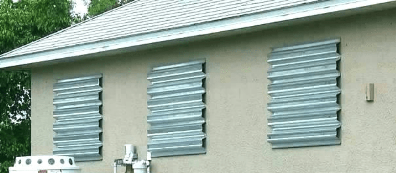 A house with a lot of windows and a roof.