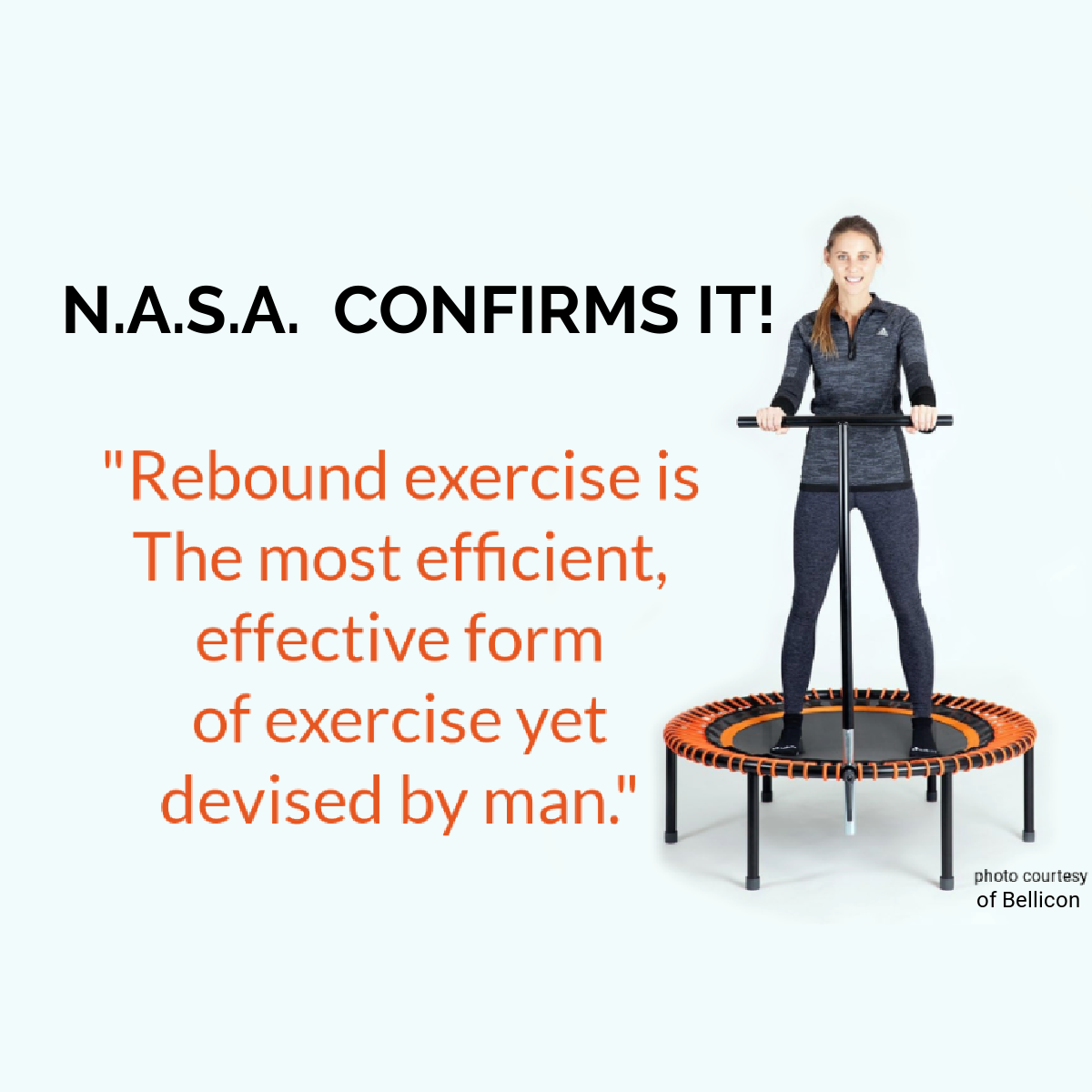 A woman is standing on a rebounder  trampoline with a handle.