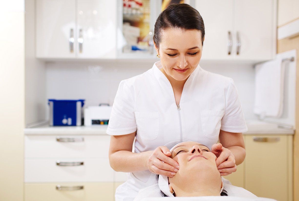 woman receiving face massage