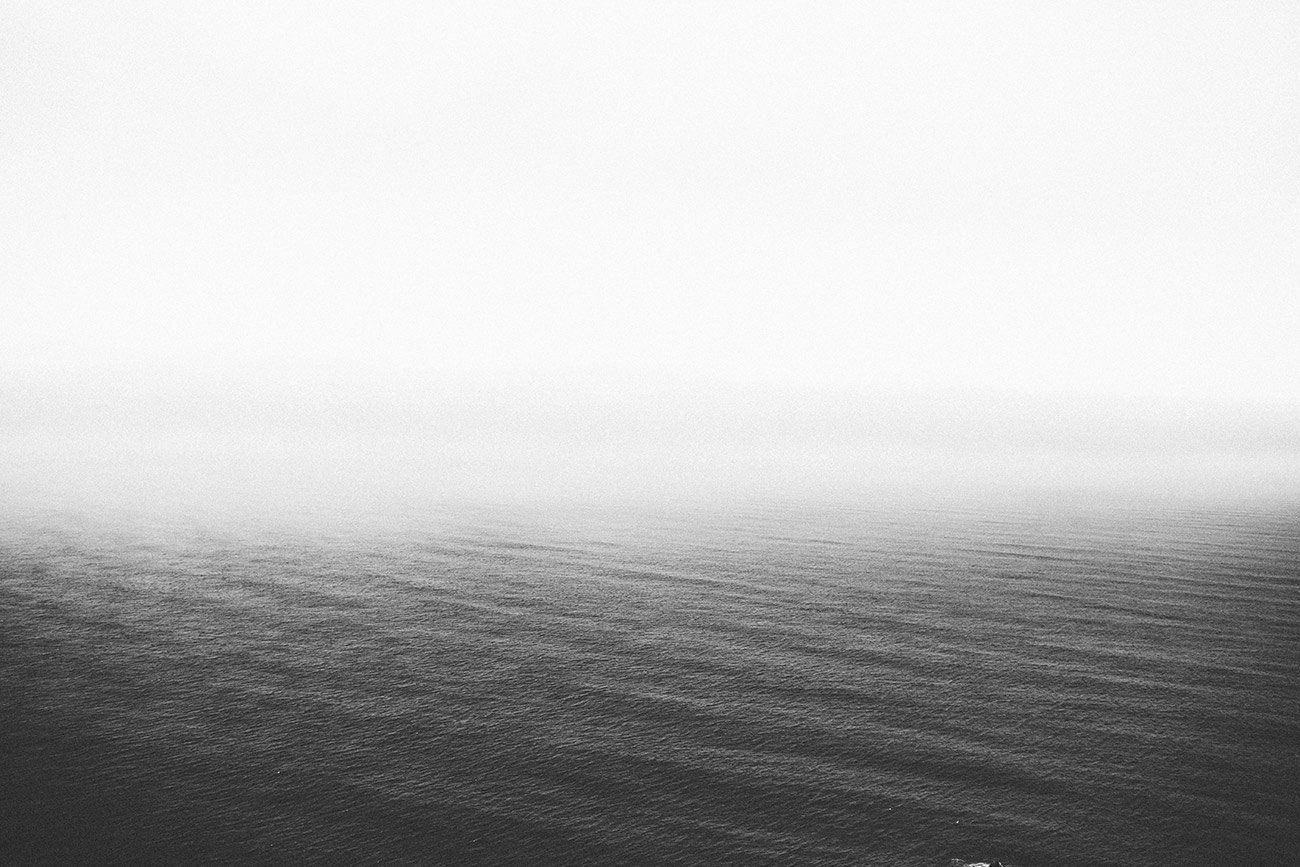 a black and white photo of a large body of water .