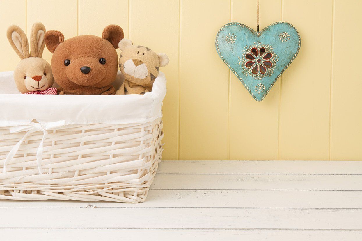 A teddy bear in a basket