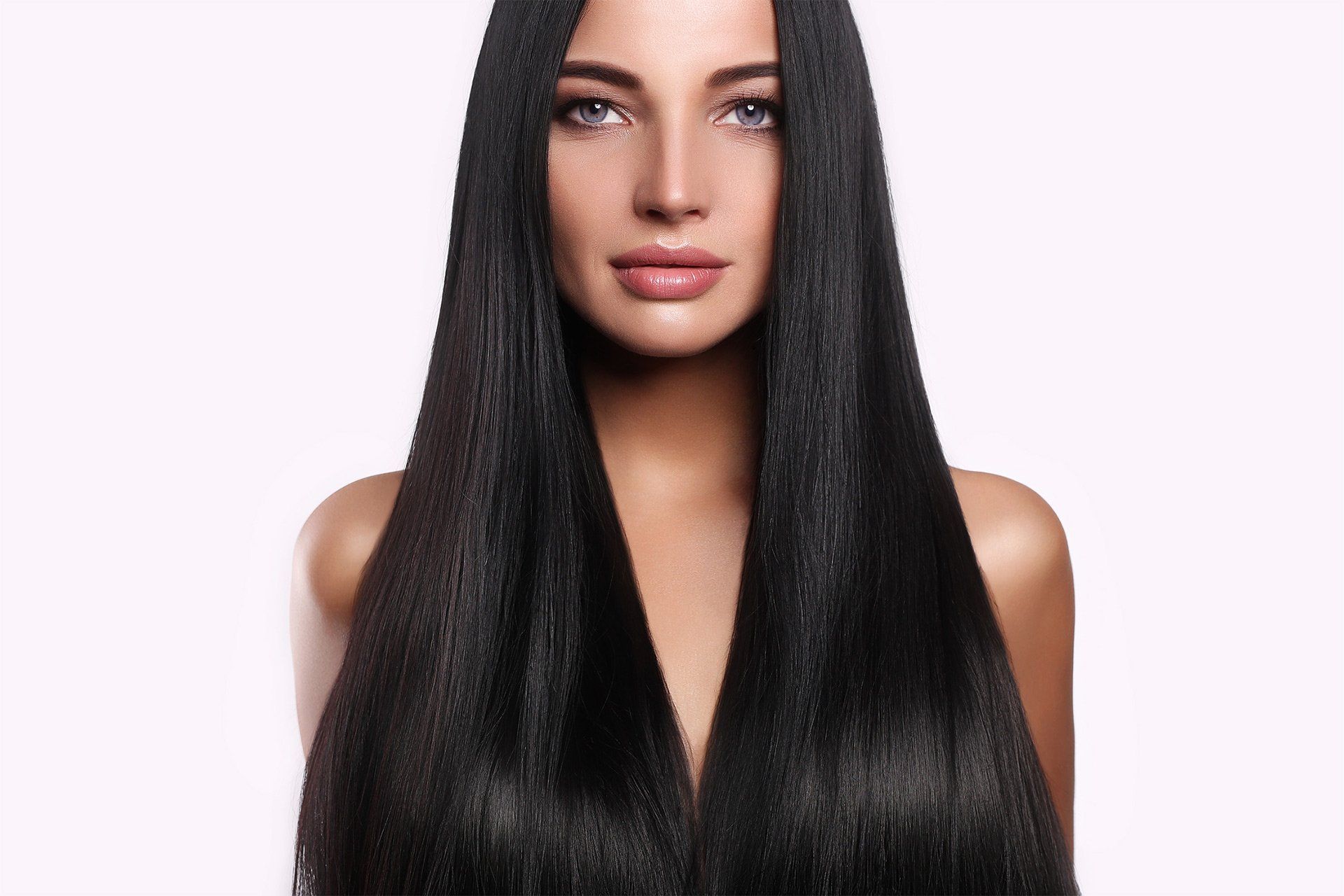Beautiful woman with long straight hair, representing Mokara Solutions, specializing in hair and skin wellness.