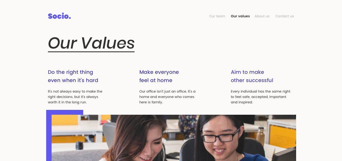 Page showing company values. Two women smiling at computer.