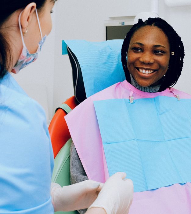 Woman smiling with dentist