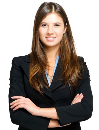 A woman in a black suit with her arms crossed