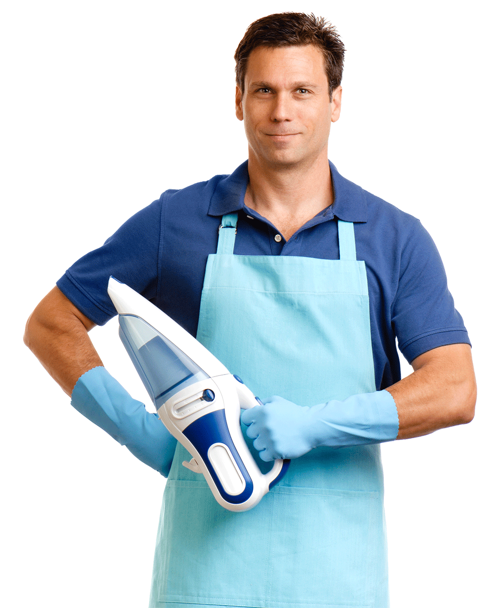 A man wearing an apron and gloves is holding a vacuum cleaner