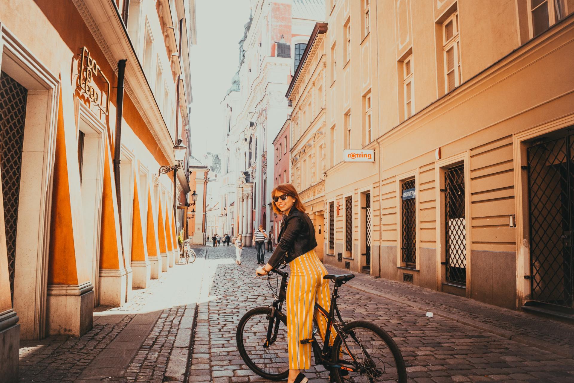 a person riding a bike on an empty street