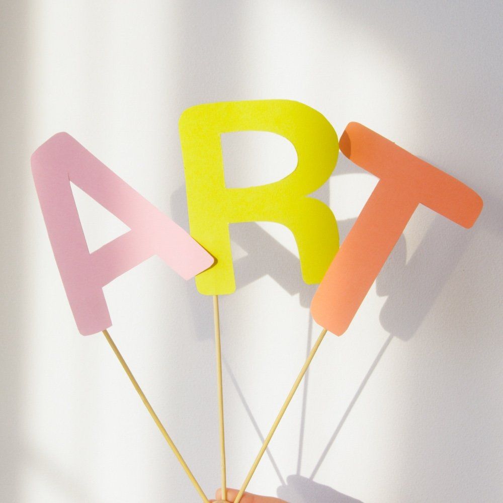 The letters a b and t are on sticks