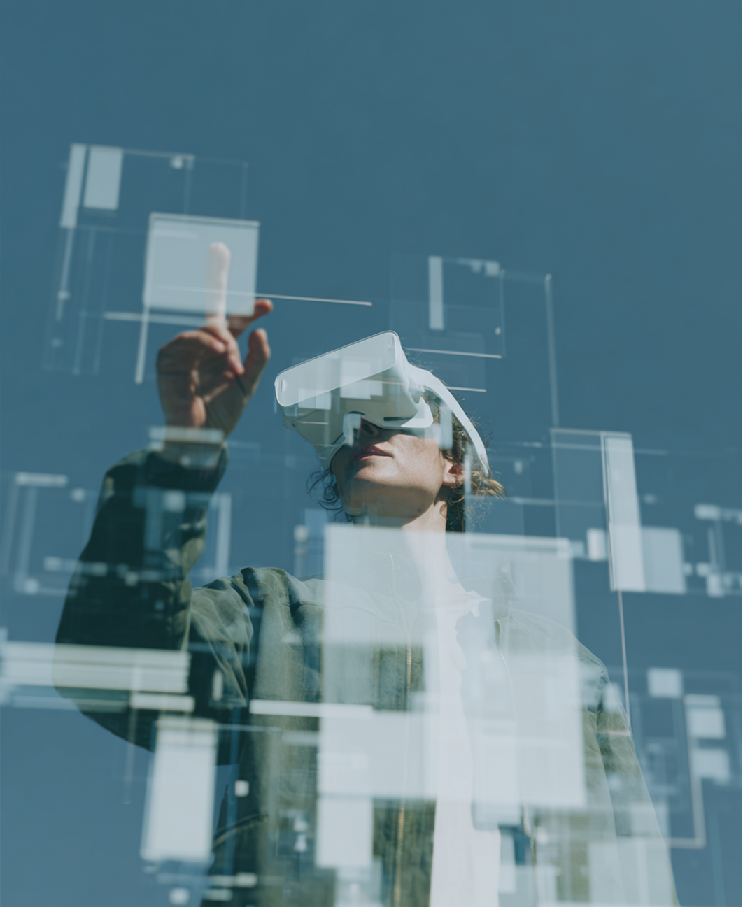Person wearing VR headset interacts with digital interface; blue sky backdrop.