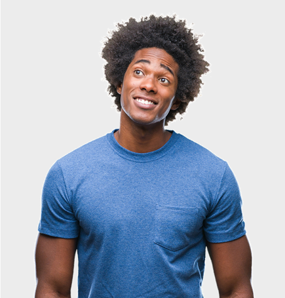 A man in a blue t-shirt is smiling and looking up.