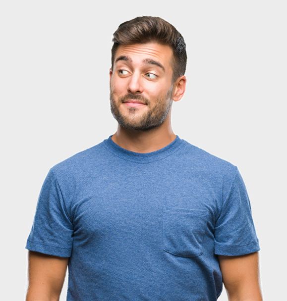 A man in a blue t-shirt is looking up and making a funny face.