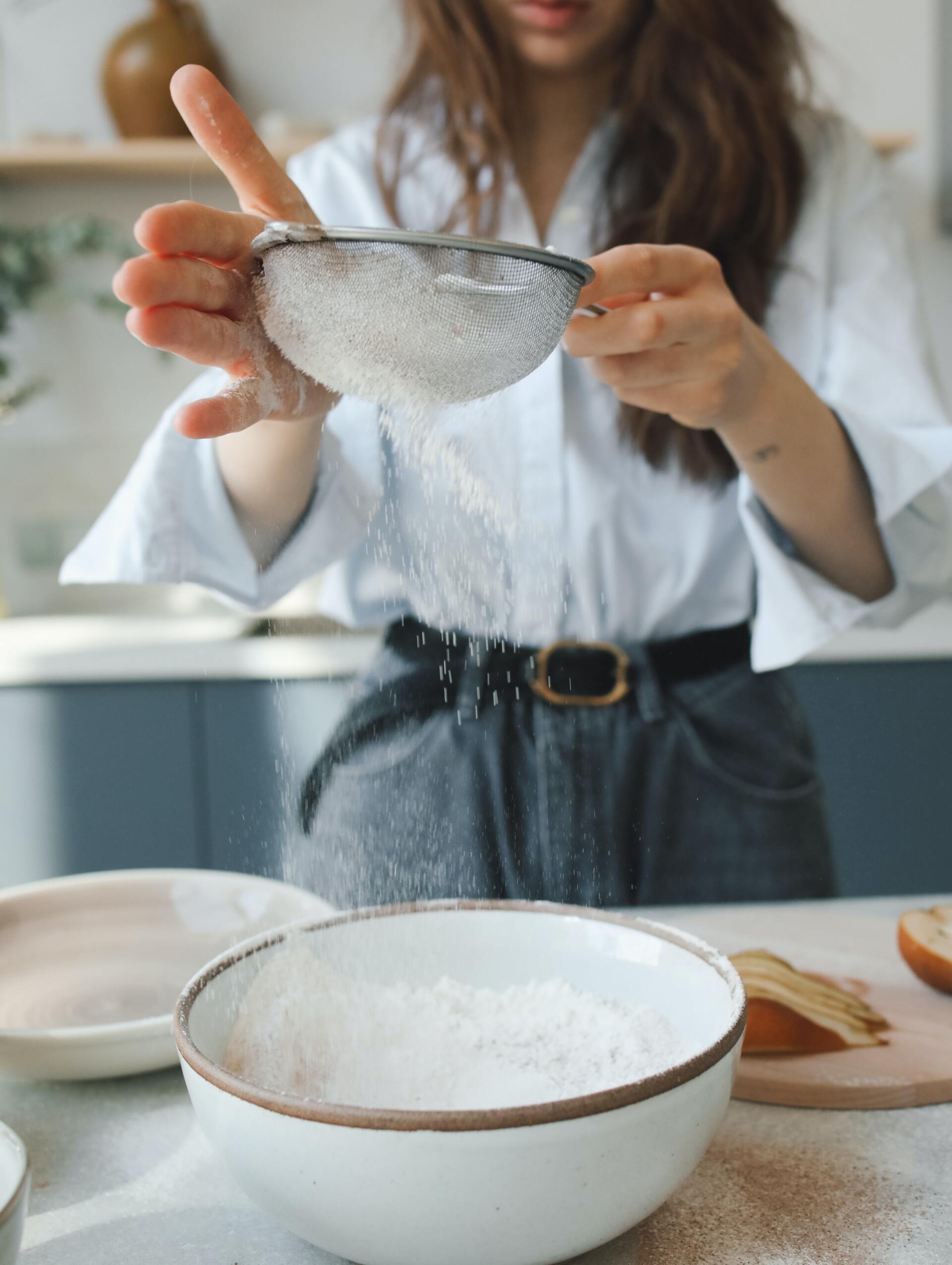 a women in her kitchen cooking free of mice