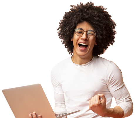 A man with an afro is holding a laptop and celebrating.