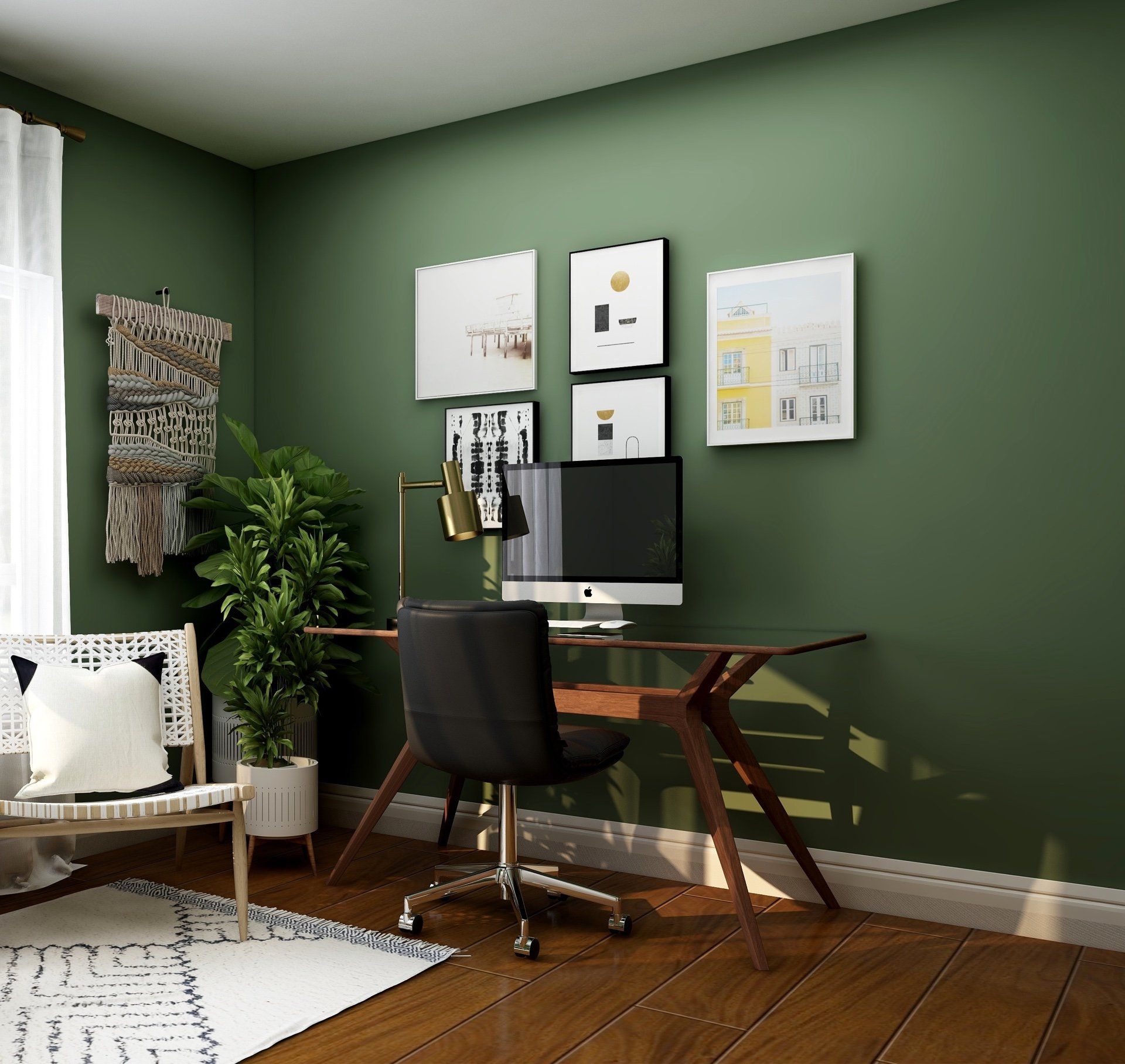 A room with green walls and a desk with a computer on it