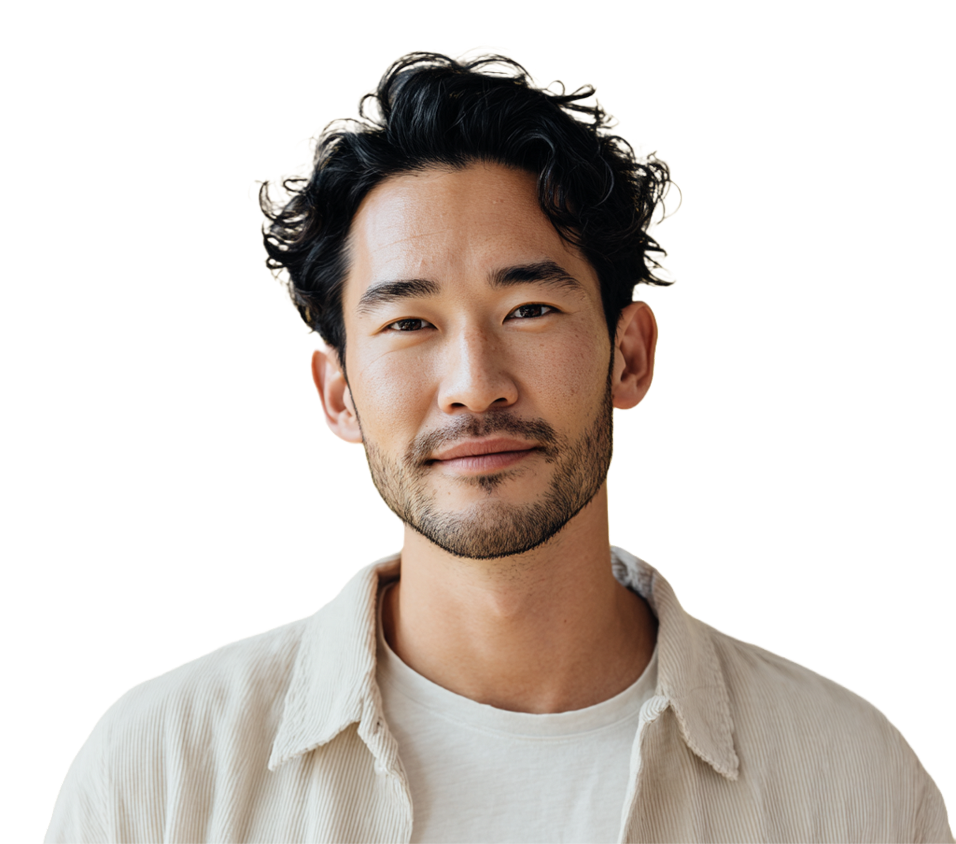 Man with dark curly hair and a subtle smile, wearing a light-colored button-up shirt.