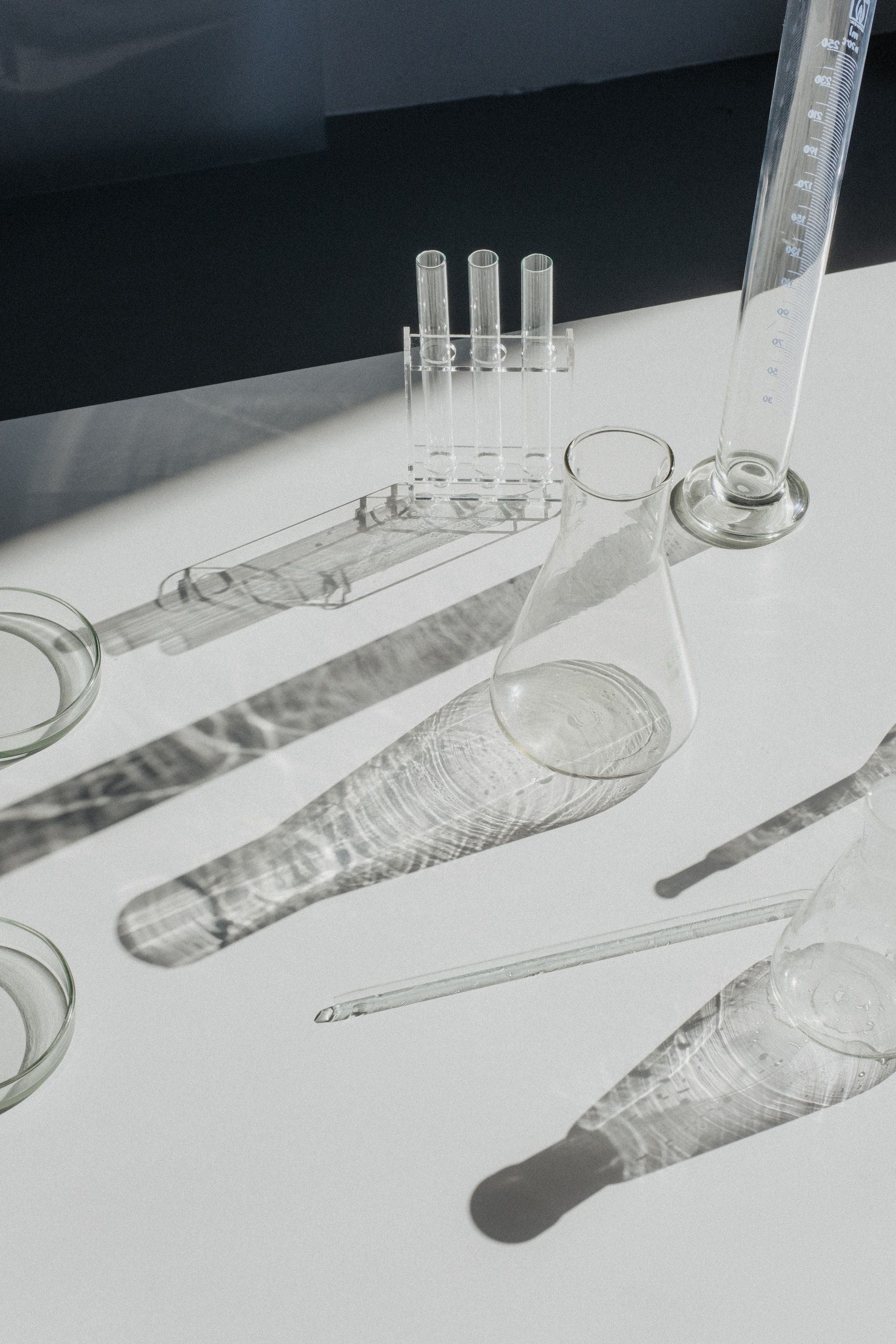 A black and white photo of a table with beakers and measuring cups