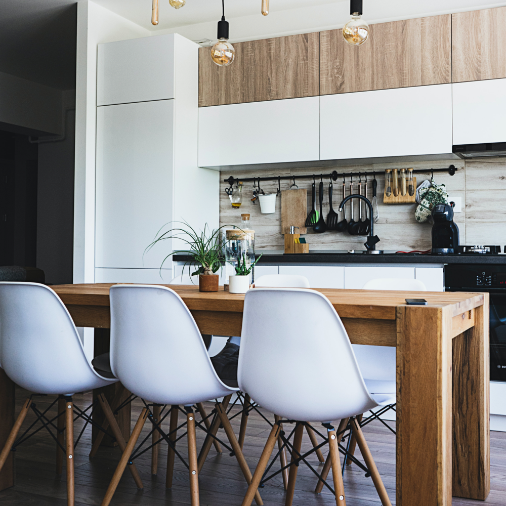 Modern kitchen with wooden accents and painted cabinets. House painting professionals for kitchen transformations.