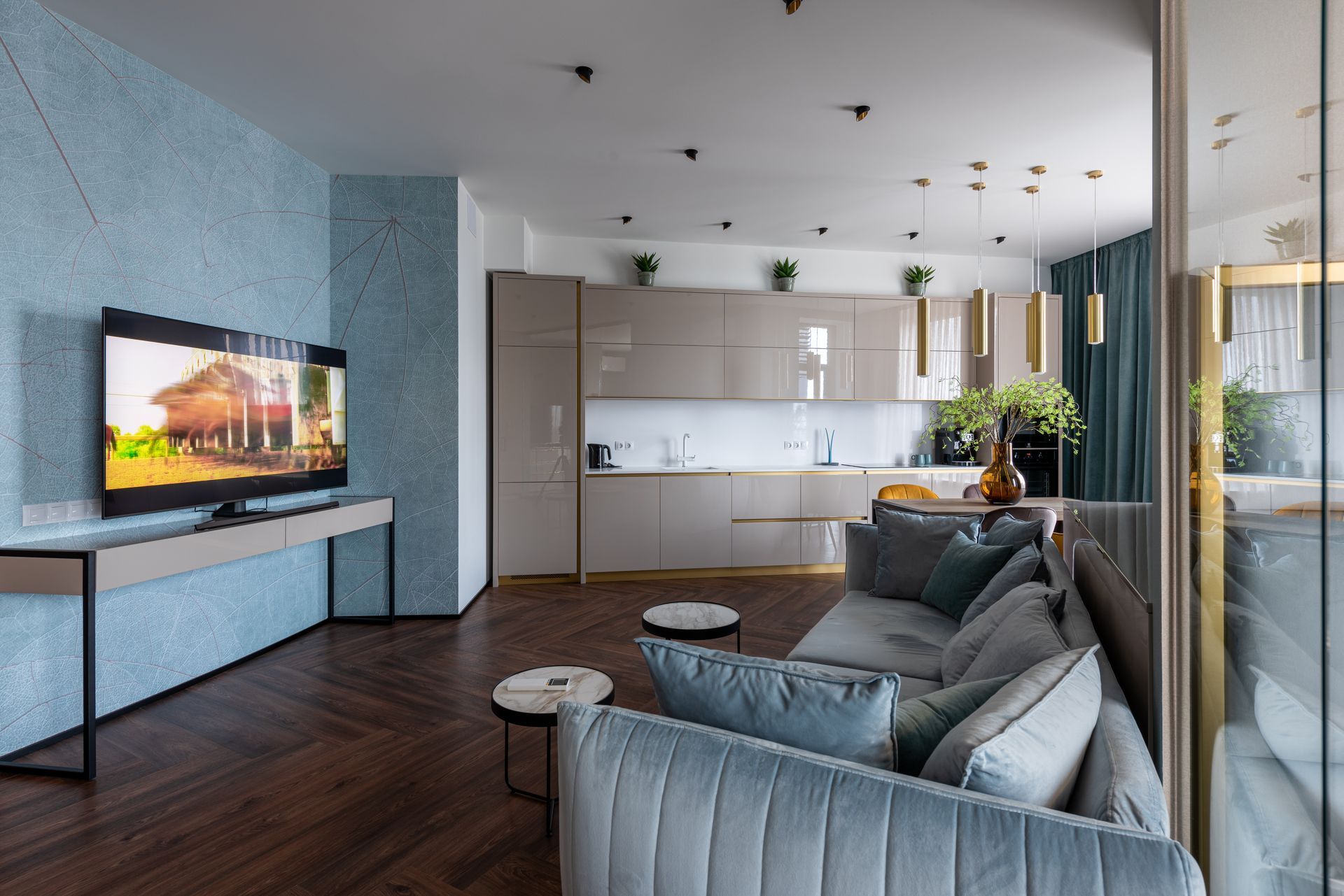 A living room with a couch and a flat screen tv.