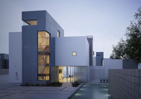 Modern, multi-story home with rectangular forms, glass windows, and a pool in front.