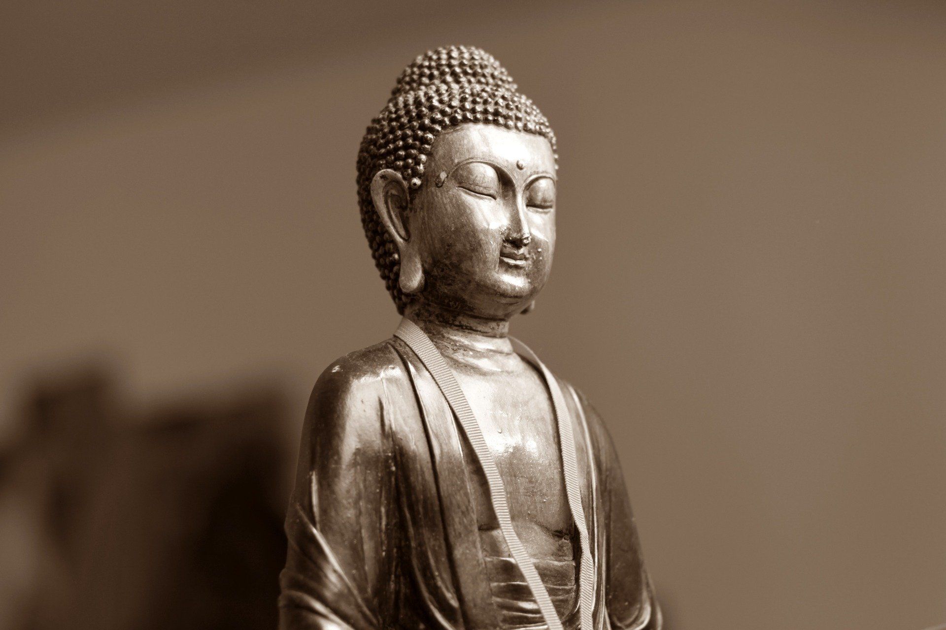 sepia colored buddha chest and head