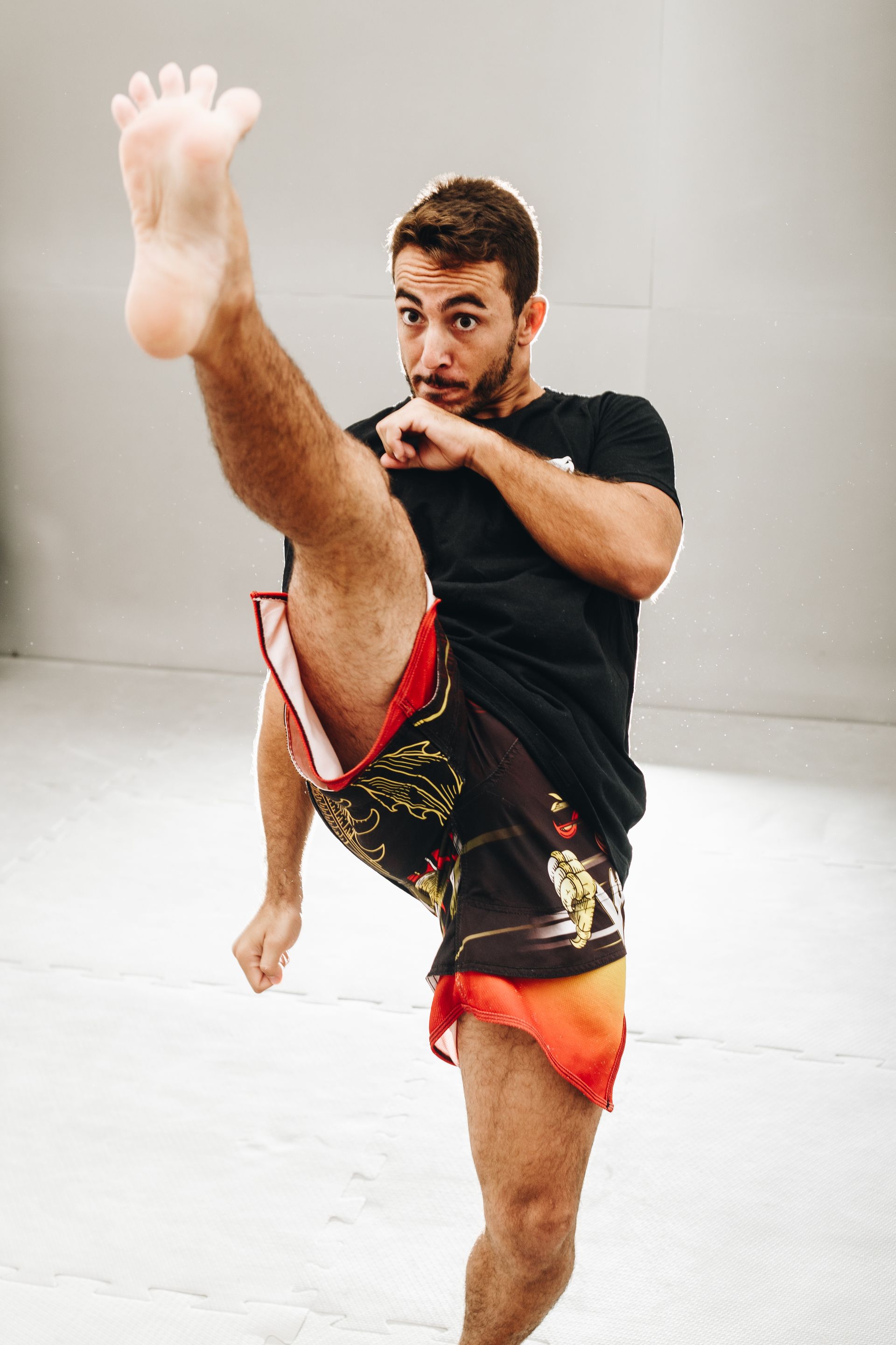 a man is kicking his leg in the air .