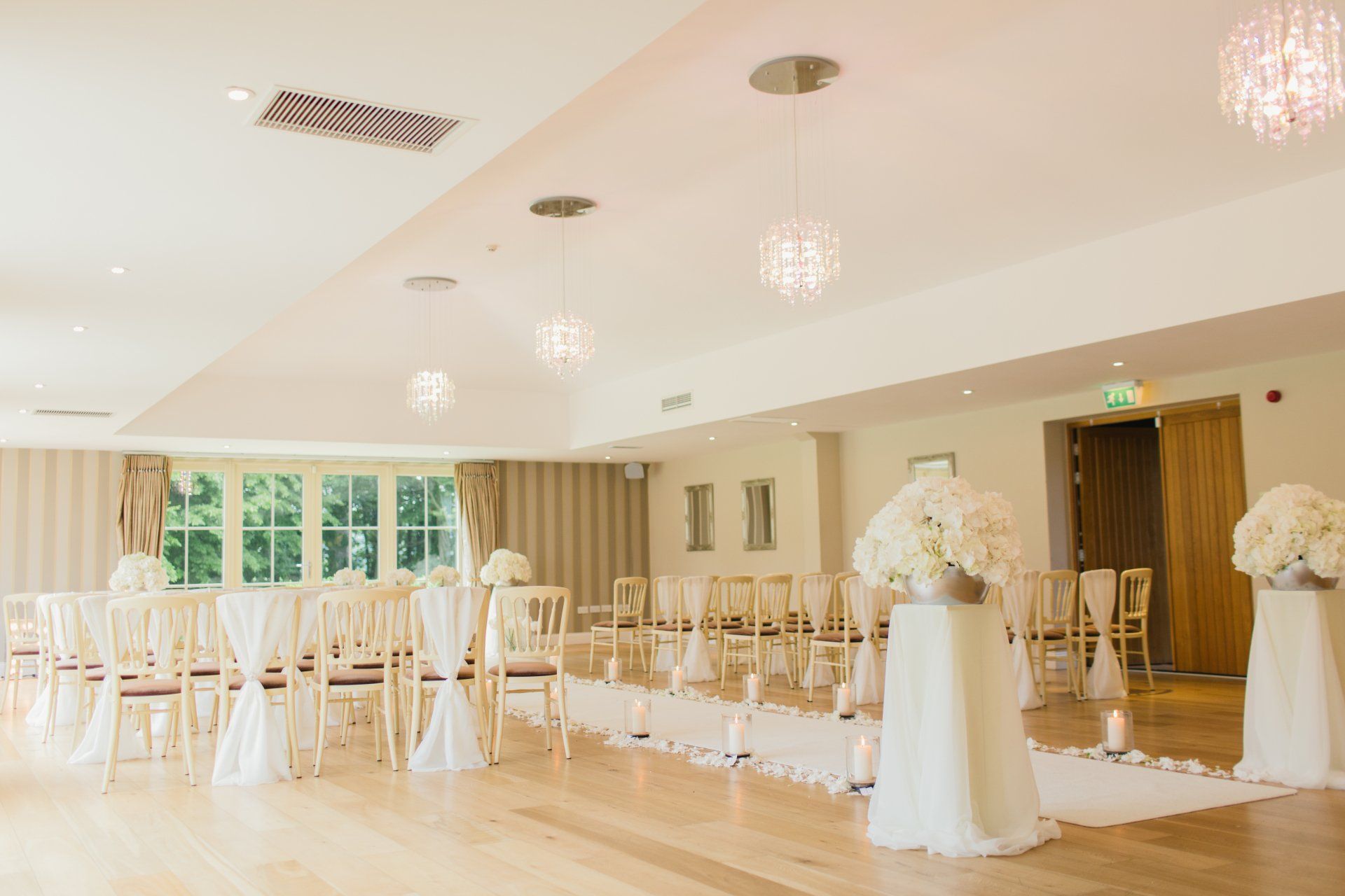 a wedding ceremony is being held in a large room