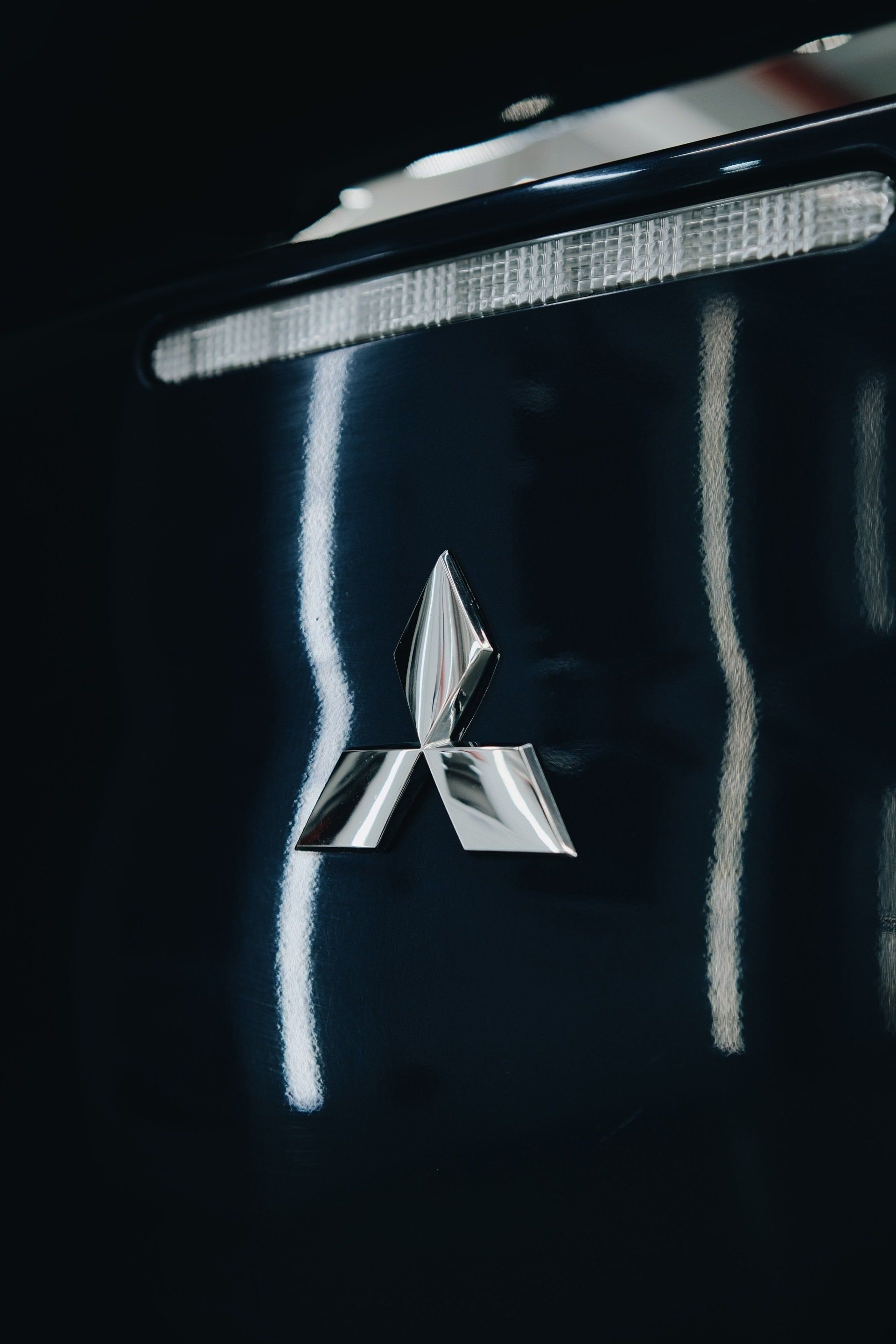 chrome emblem, nameplate, logo badge
