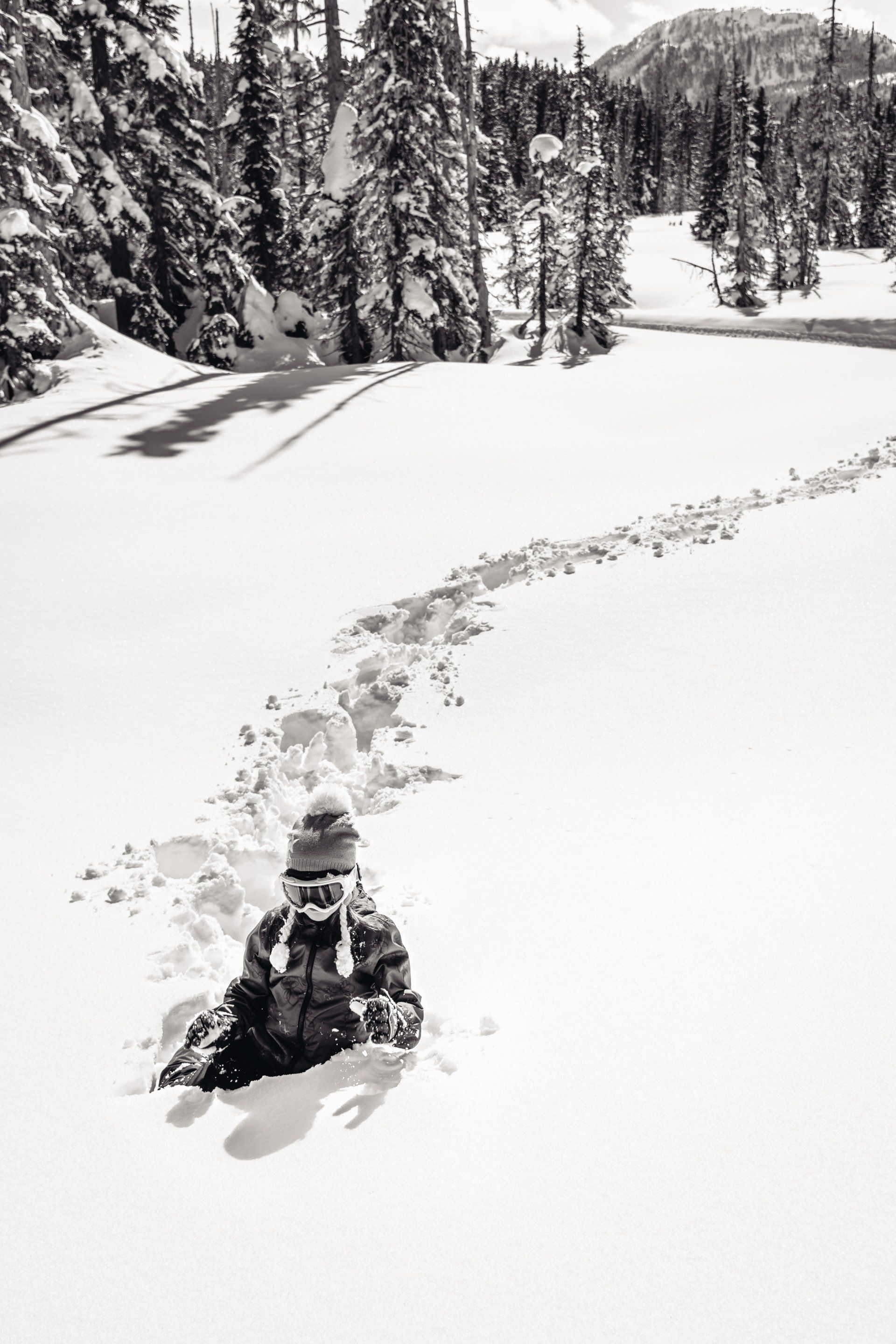 black and white photo of traveler in deep snow
