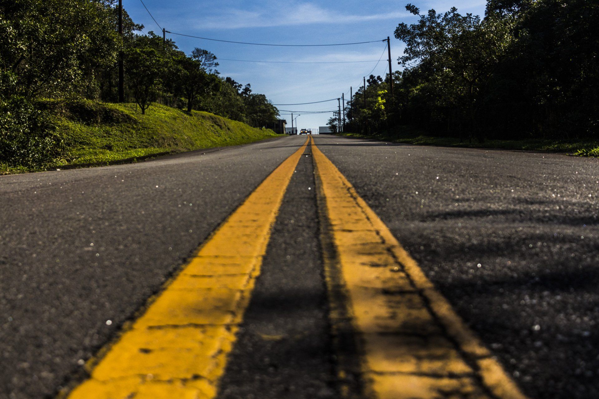 A road with a yellow line on the middle of it