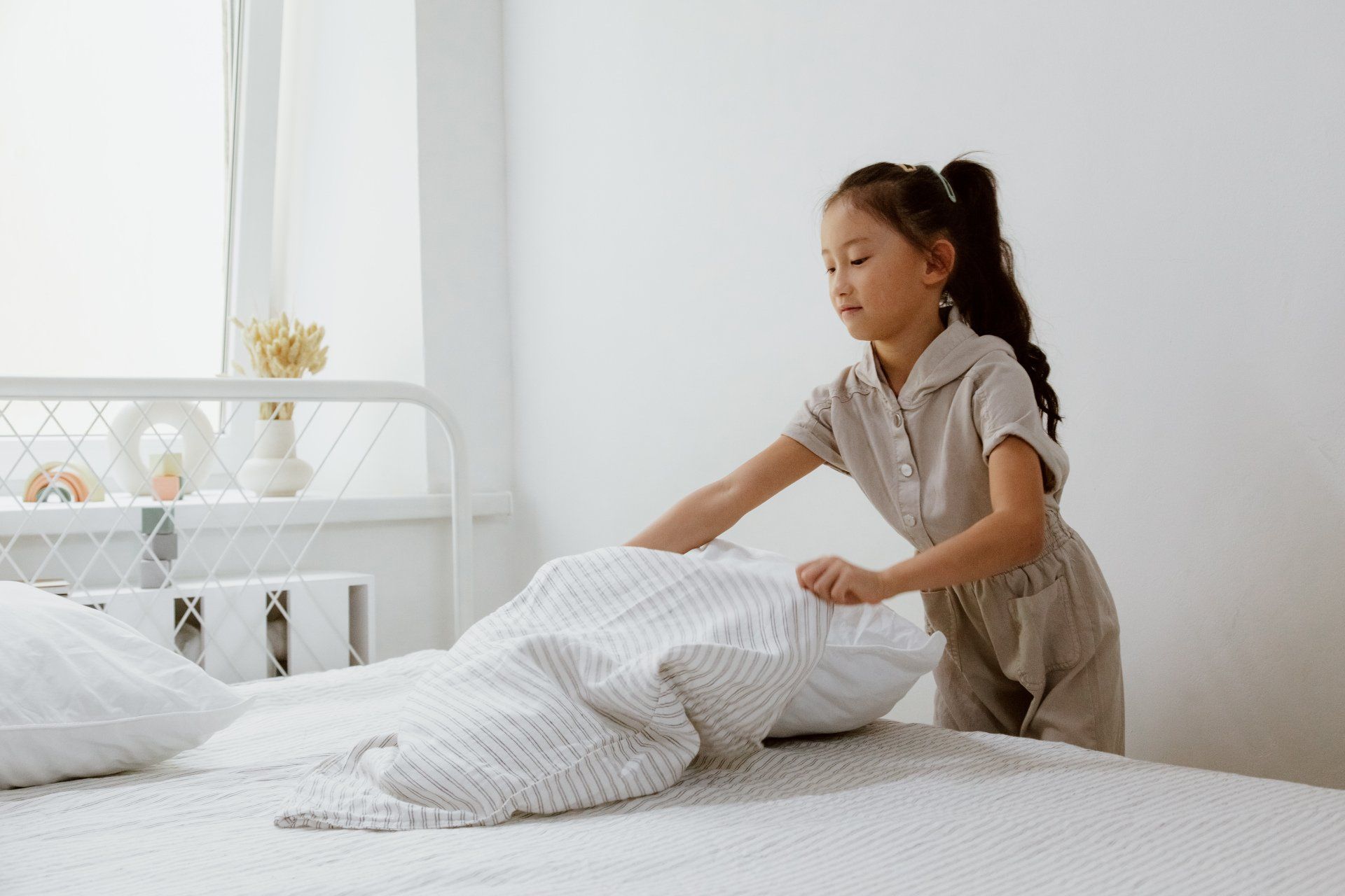 a child making her bed