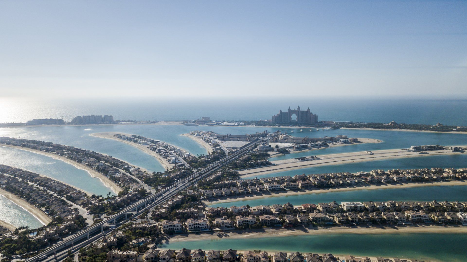 An aerial view of the palm jumeirah islands in the middle of the ocean.