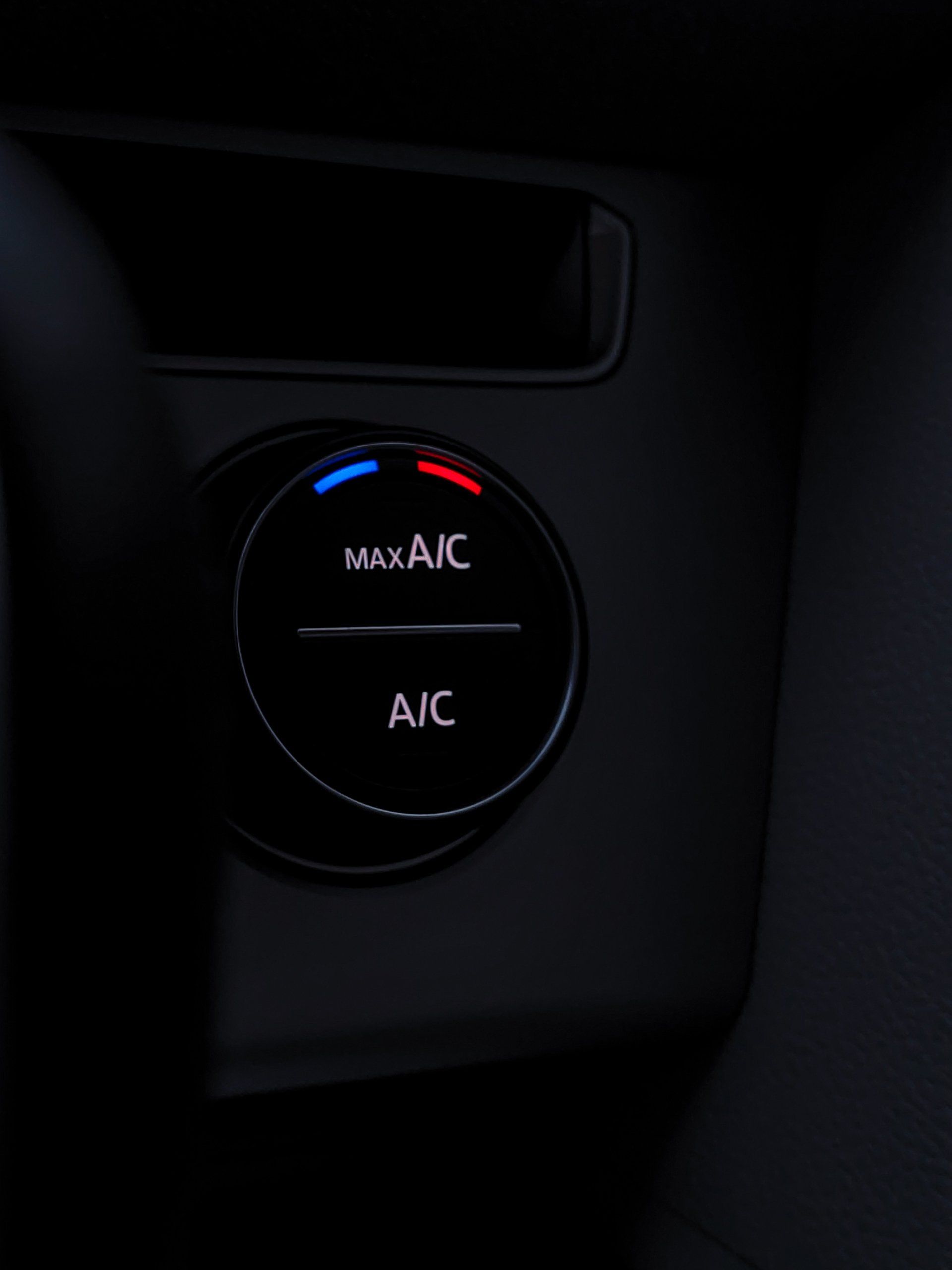a close up of a button that says max a/c and a/c