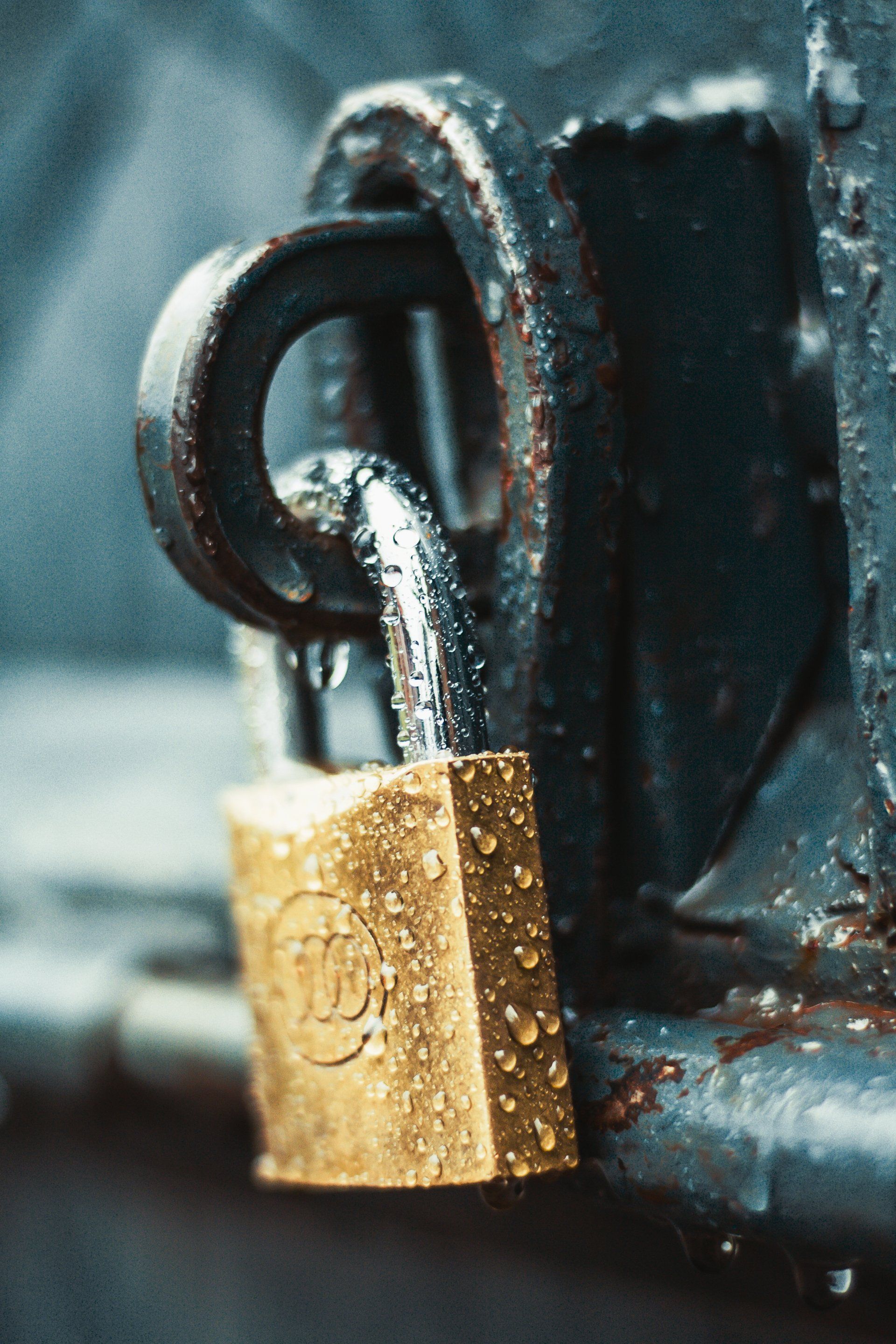 a close up of a padlock with water dripping out of it .