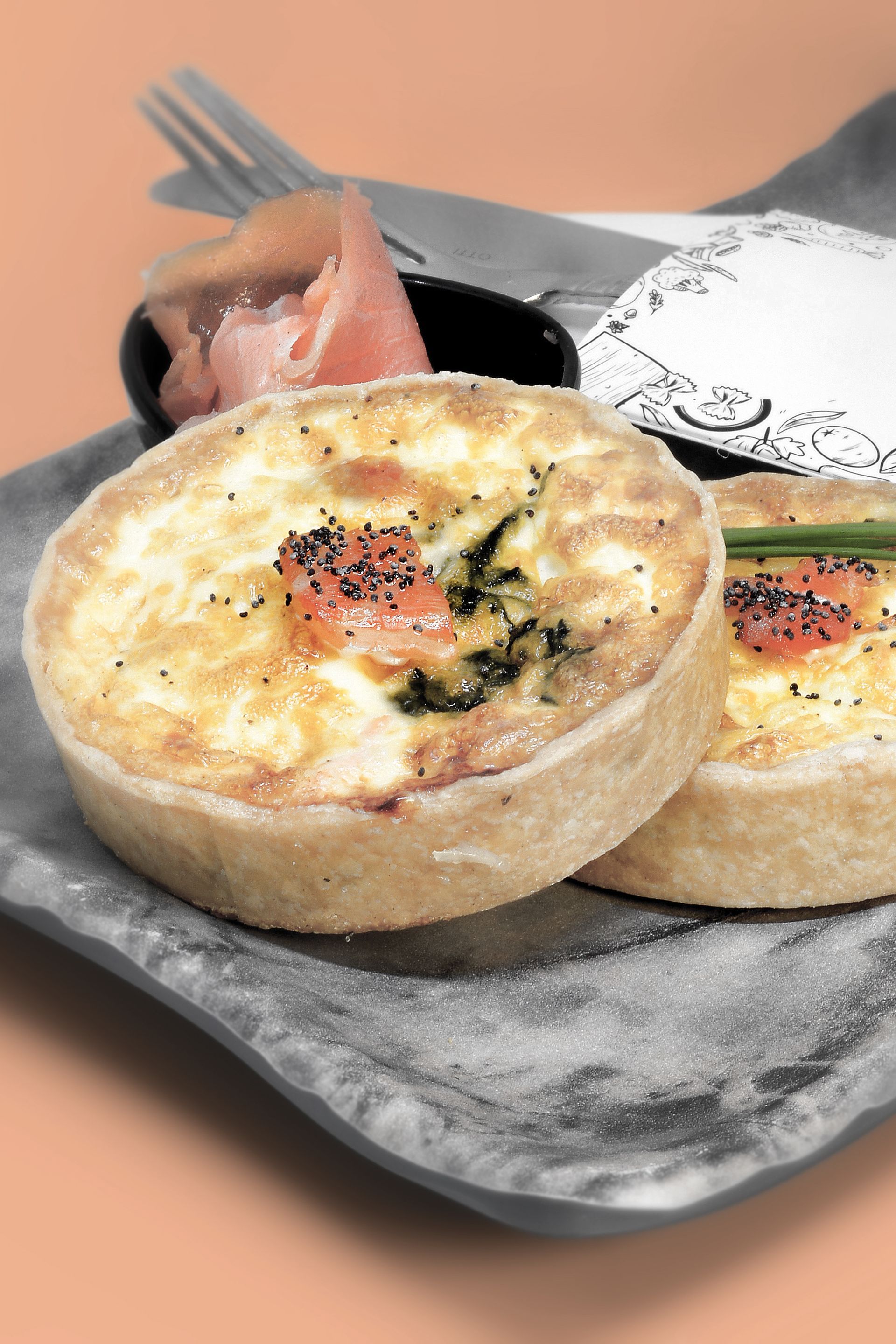 A quiche with spinach and tomato