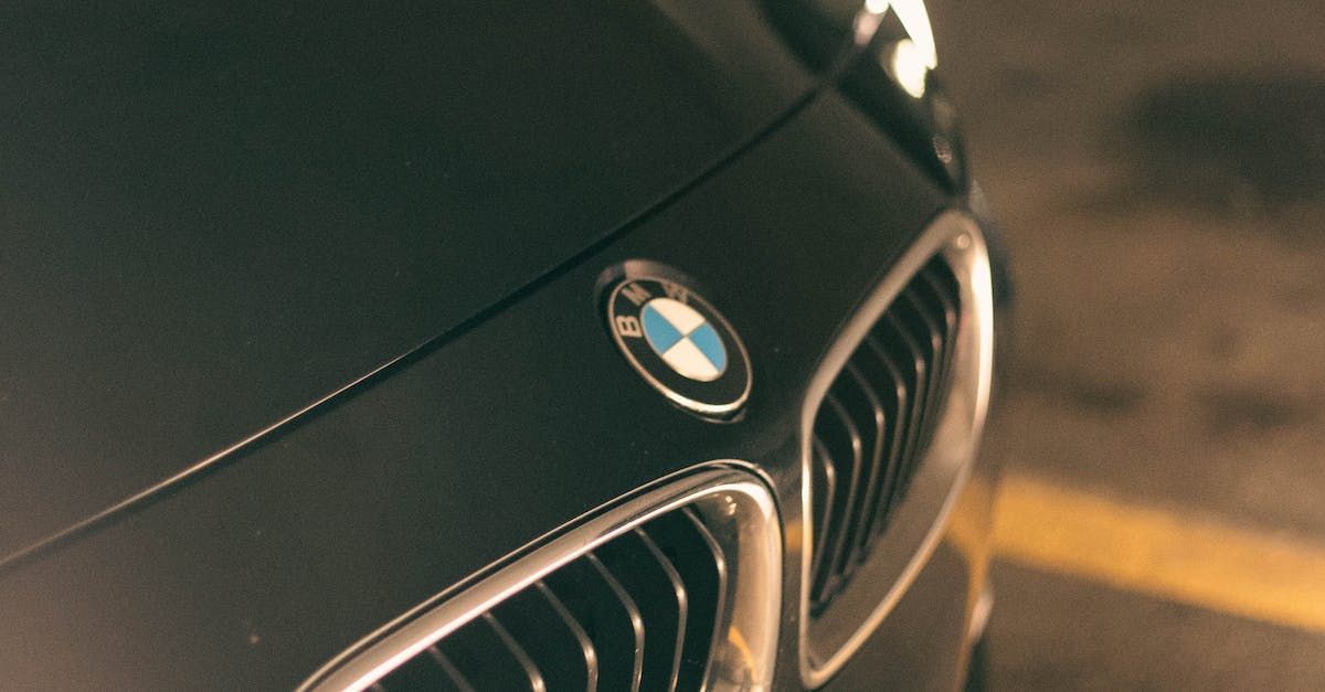 a bmw car is parked in a parking lot