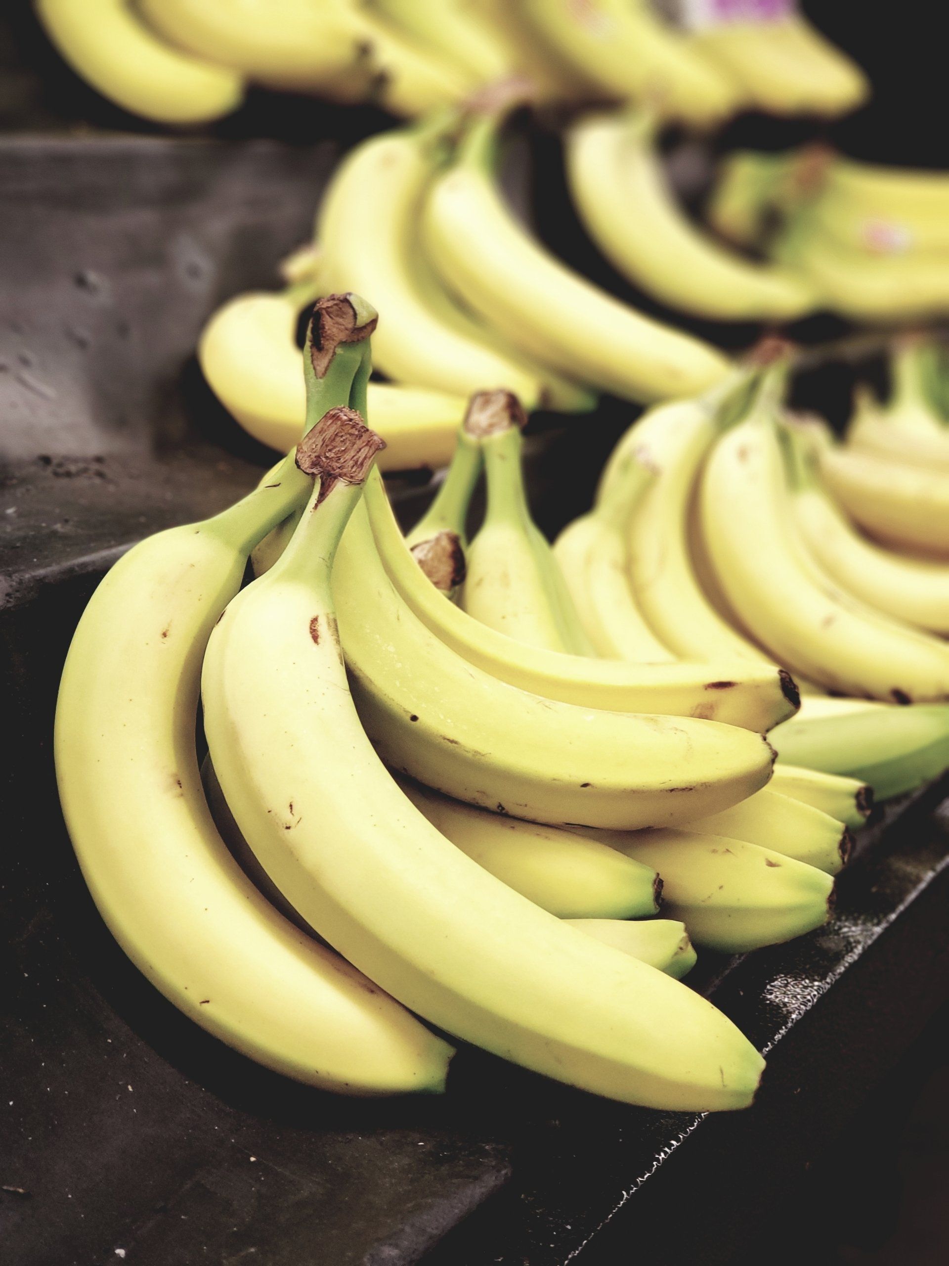 A bunch of bananas are sitting on a table