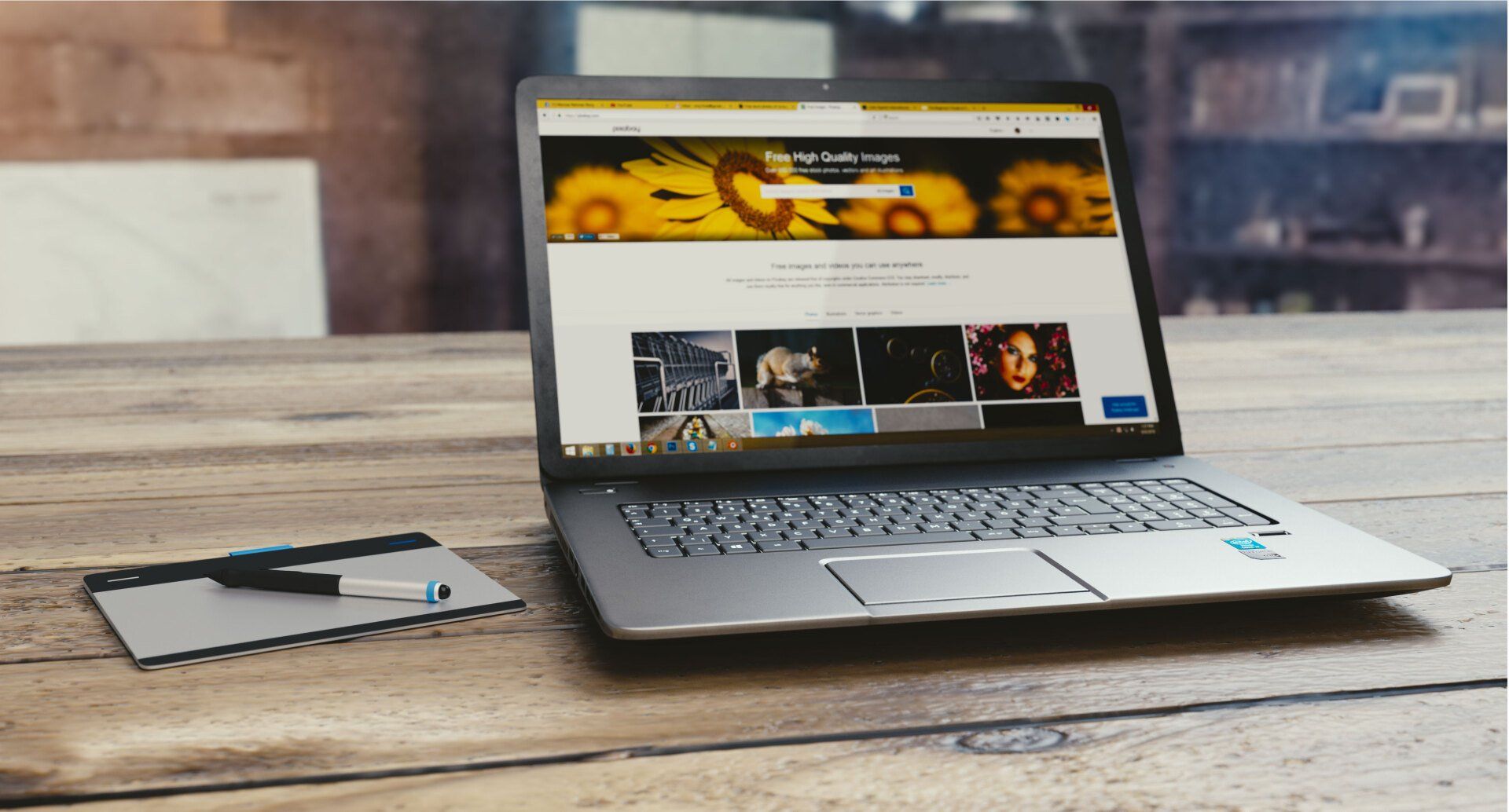 desk with a computer on it that is displaying a website for images