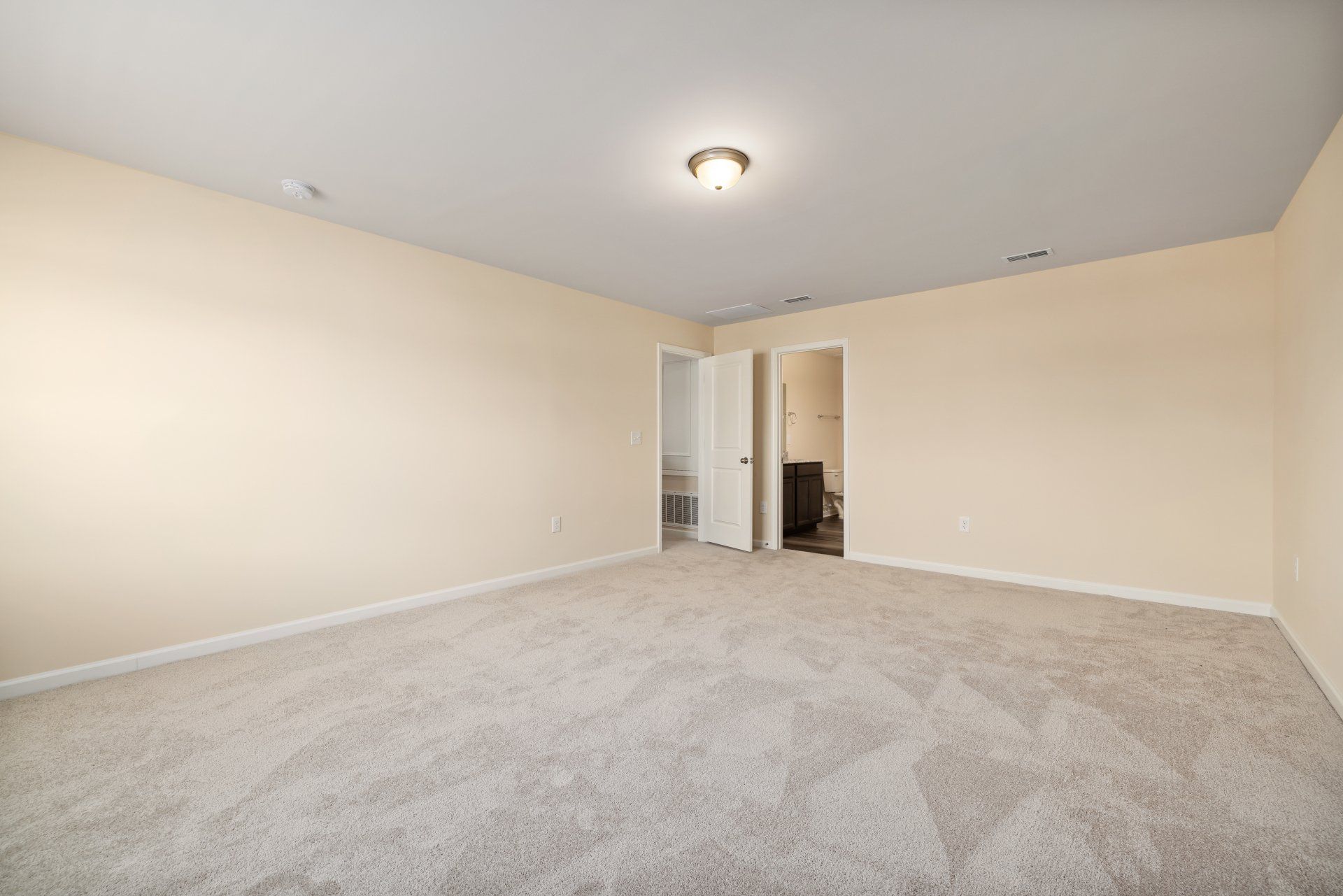 empty room with white walls and floor